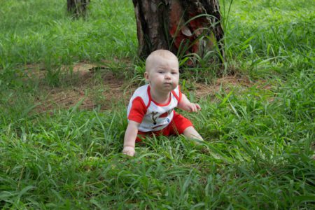 Baby boy during Christmas family shoot in Bryanston pine forest